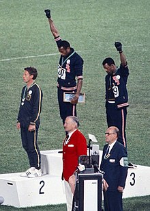 220px-John_Carlos,_Tommie_Smith,_Peter_Norman_1968cr